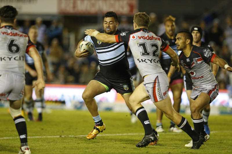Andrew Fifita of the Cronulla-Sutherland Sharks is tackled by Ryan Hoffman of the New Zealand Warriors during their round 9 NRL match at Redmonis Stadium on Saturday May 9, 2015. Andrew Fifita of the Cronulla-Sutherland Sharks is tackled by Ryan Hoffman of the New Zealand Warriors during their round 9 NRL match at Redmonis Stadium on Saturday May 9, 2015.