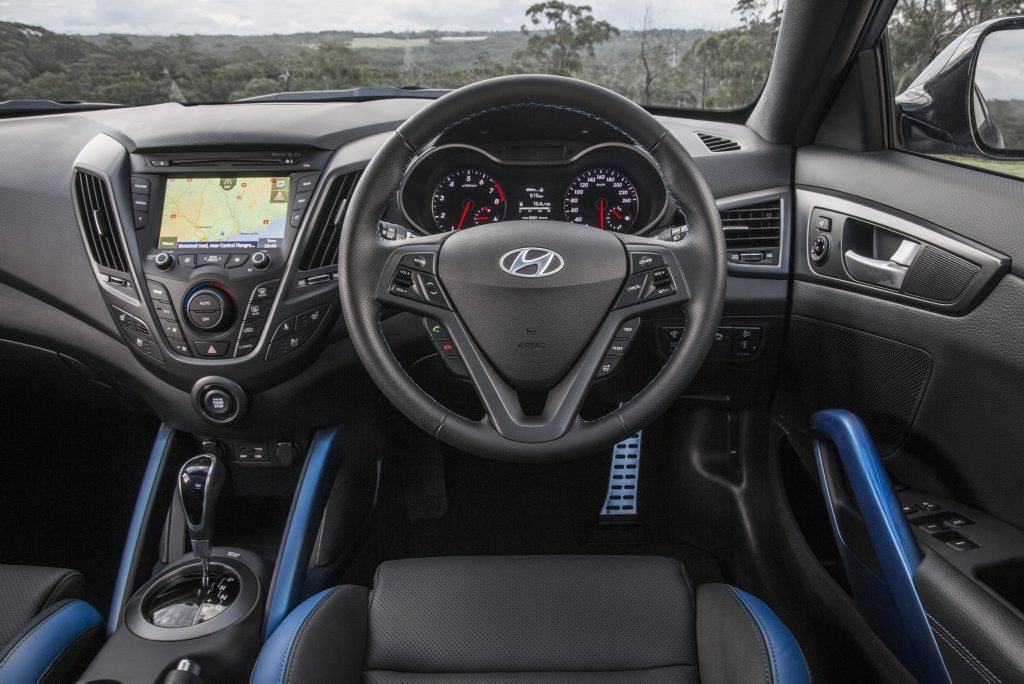Veloster's cabin receives sporty blue flashes when optioned with matt blue exterior paint Veloster's cabin receives sporty blue flashes when optioned with matt blue exterior paint