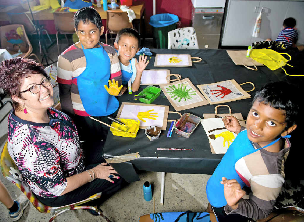 HANDS UP FOR FUN: Early Childhood Network’s Lyn Hughes with Darren Fei, 7, Anupam Peetha, 7, and Nirupam Peetha, 7. HANDS UP FOR FUN: Early Childhood Network’s Lyn Hughes with Darren Fei, 7, Anupam Peetha, 7, and Nirupam Peetha, 7.