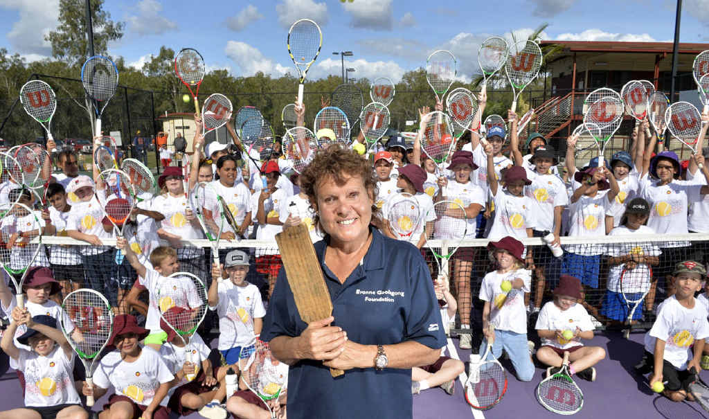 LIVING LEGEND: Evonne Goolagong Cawley, holding the paddle she first used to hit a tennis ball in her backyard as a child, encourages Indigenous Ipswich children to achieve their dreams by staying at school while enjoying tennis. LIVING LEGEND: Evonne Goolagong Cawley, holding the paddle she first used to hit a tennis ball in her backyard as a child, encourages Indigenous Ipswich children to achieve their dreams by staying at school while enjoying tennis.