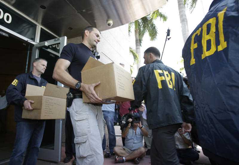 Federal agents load a van with boxes of evidence taken from the headquarters of the Confederation of North, Central America and Caribbean Association Football Federal agents load a van with boxes of evidence taken from the headquarters of the Confederation of North, Central America and Caribbean Association Football