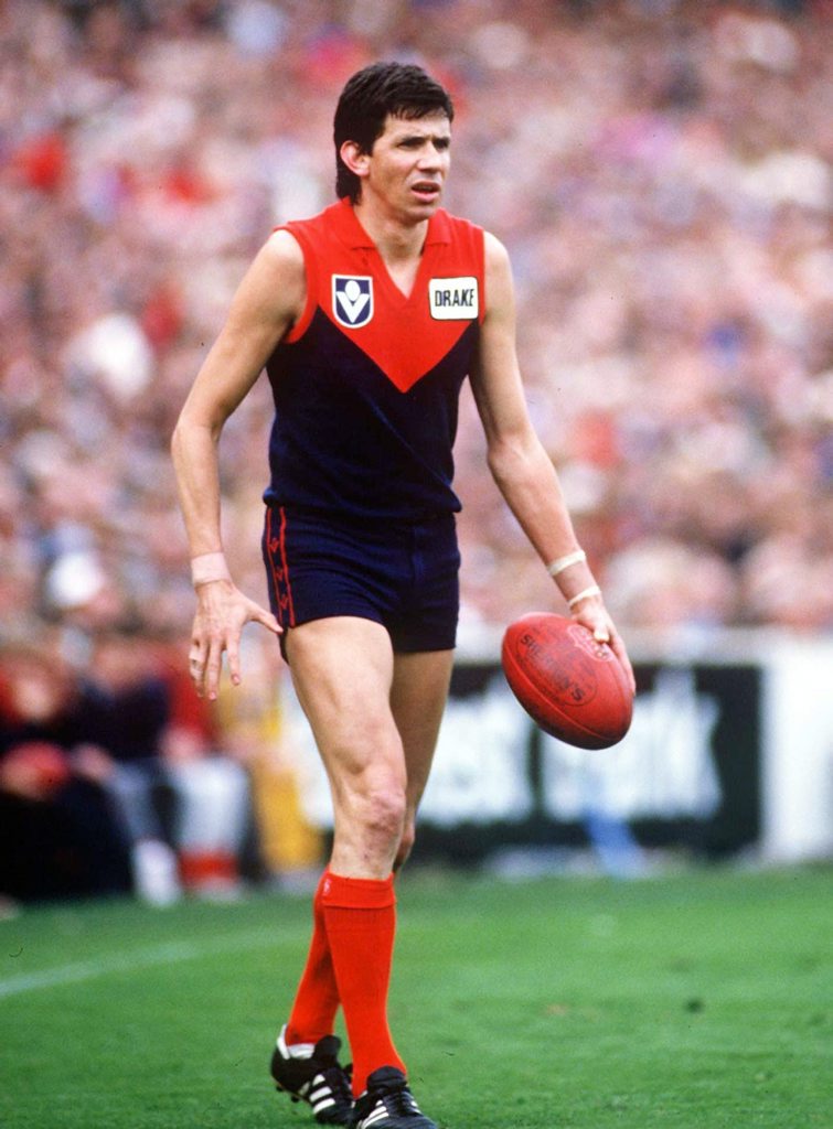 1980's: Robert Flower of Melbourne surveys his options, in the VFL match between Melbourne and Sydney, played at the Melbourne Cricket Ground, Melbourne, Australia. Mandatory Credit: Allsport Australia/ALLSPORT 1980's: Robert Flower of Melbourne surveys his options, in the VFL match between Melbourne and Sydney, played at the Melbourne Cricket Ground, Melbourne, Australia. Mandatory Credit: Allsport Australia/ALLSPORT