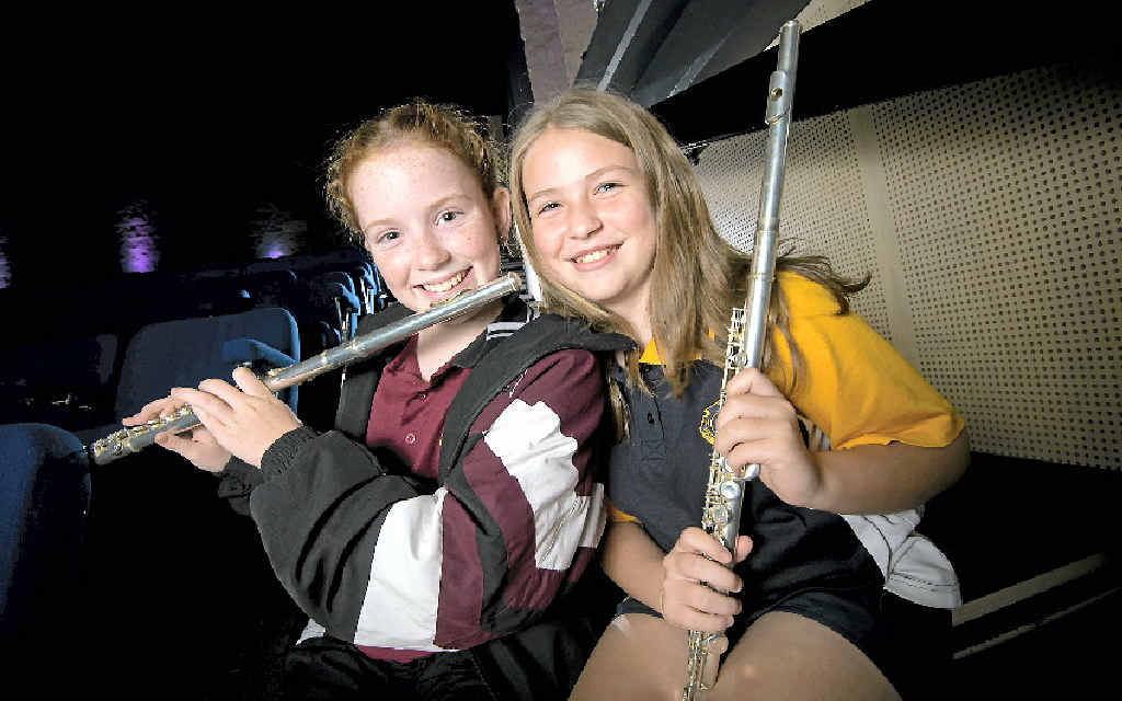 TUNED UP: Toolooa State High Year 7 student Molly Tolan and Gladstone State High’s Kaitlyn Duckham love playing the flute. BELOW: From violins and drums to cow bells and clarinets, there was every instrument represented at the group rehearsal of high school students before their performance to the public on Friday. TUNED UP: Toolooa State High Year 7 student Molly Tolan and Gladstone State High’s Kaitlyn Duckham love playing the flute. BELOW: From violins and drums to cow bells and clarinets, there was every instrument represented at the group rehearsal of high school students before their performance to the public on Friday.