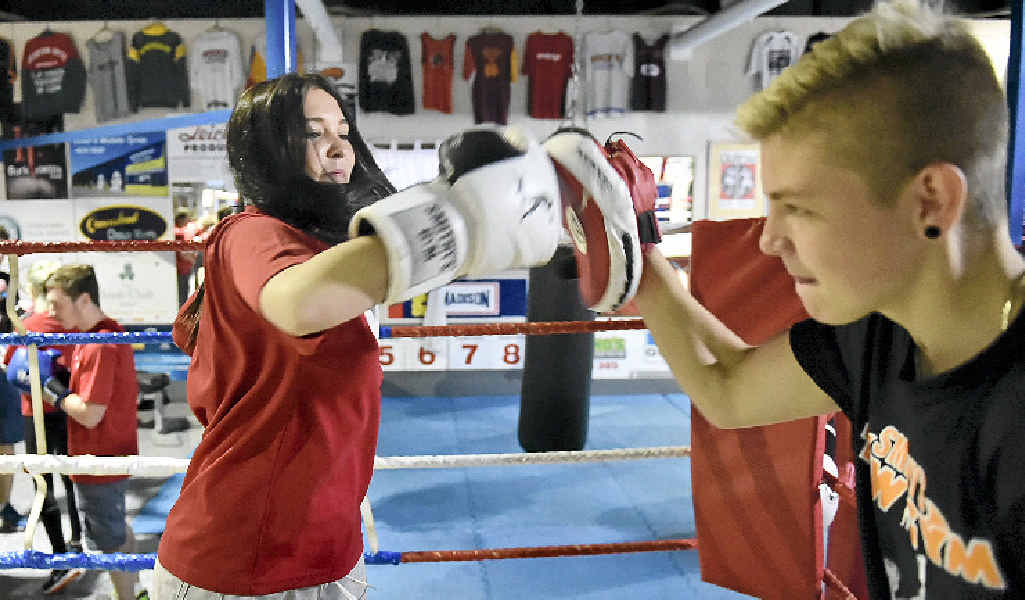 TRAINING: A boxer from Smithy’s Gym, Chris Bracken, works out with team member Yasmine Loffel.