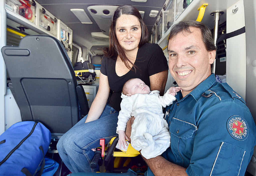 SPECIAL MOMENT: Paramedic Kendall Cox with baby Lexie and her mum Melissa Wilkins at the Howard ambulance station. SPECIAL MOMENT: Paramedic Kendall Cox with baby Lexie and her mum Melissa Wilkins at the Howard ambulance station.