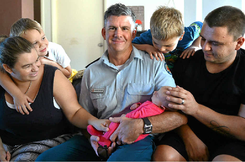 MEETING UP: QAS officer Justin Cumming helped Anthony Turner deliver his daughter, Sophia, after his wife, Rebecca went into labour. His sons, Tyson and Rory watch on. MEETING UP: QAS officer Justin Cumming helped Anthony Turner deliver his daughter, Sophia, after his wife, Rebecca went into labour. His sons, Tyson and Rory watch on.