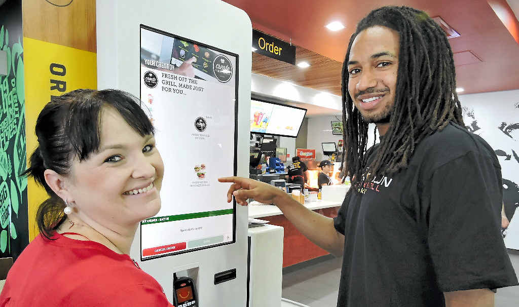 NEW OPTIONS: McDonald’s Northern Beaches and Caneland Central owner Niki Ramsay shows the Create Your Taste menu to Mackay Meteors player Mathew Adekponya. NEW OPTIONS: McDonald’s Northern Beaches and Caneland Central owner Niki Ramsay shows the Create Your Taste menu to Mackay Meteors player Mathew Adekponya.