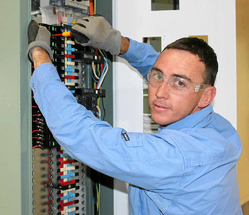 CHARGING AHEAD: Electrician Owen Murray is excited to be a finalist for Apprentice of the Year in the Queensland Training Awards. INSET: The Murray family, before Jackie’s cancer diagnosis. CHARGING AHEAD: Electrician Owen Murray is excited to be a finalist for Apprentice of the Year in the Queensland Training Awards. INSET: The Murray family, before Jackie’s cancer diagnosis.
