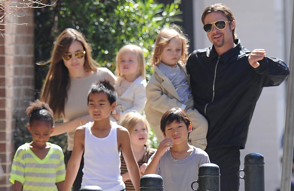 Brad Pitt and Angelina Jolie with their six children Brad Pitt and Angelina Jolie with their six children