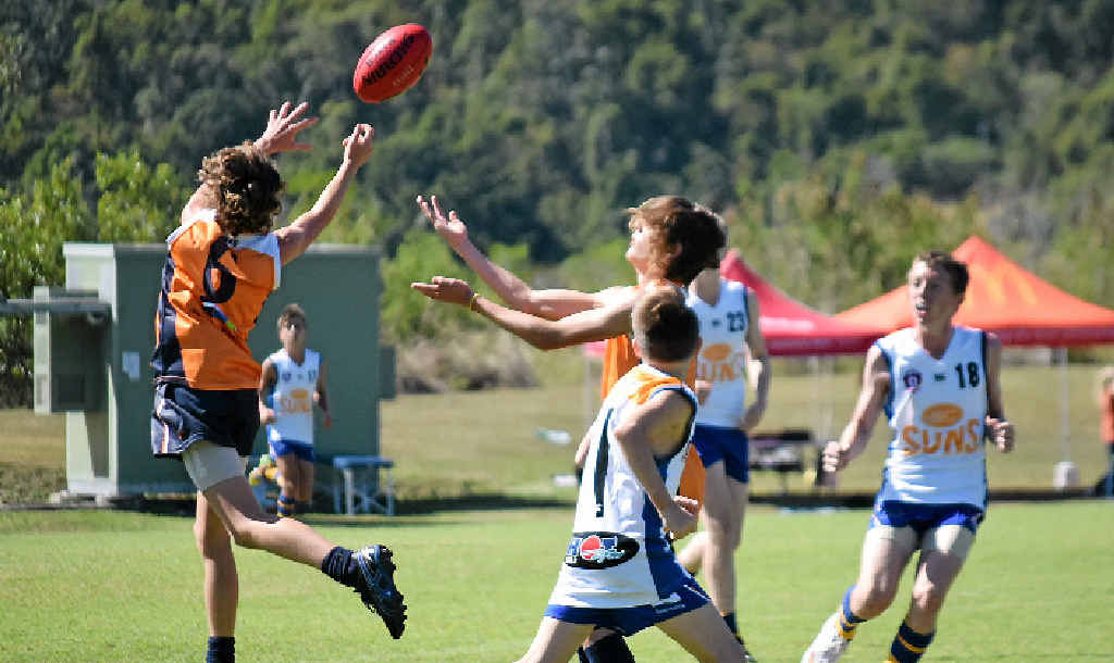 HIGH FLYING: Mitch Healey (left) flies for a mark against Townsville on Saturday at the Whitsunday Sportspark. Mitch was one of three Sea Eagles eventually picked for the CQ team. HIGH FLYING: Mitch Healey (left) flies for a mark against Townsville on Saturday at the Whitsunday Sportspark. Mitch was one of three Sea Eagles eventually picked for the CQ team.