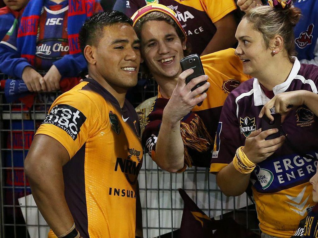 Ipswich product Joe Ofahengaue poses for photos with fans after their recent game against Newcastle. Photo: Contributed Ipswich product Joe Ofahengaue poses for photos with fans after their recent game against Newcastle. Photo: Contributed