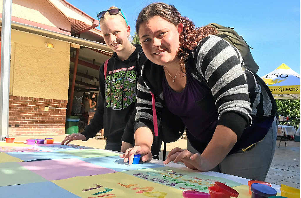 EASING STRESS: Ashleigh Hamilton and Tay Nash took part in finger painting during the Pre-Exam Stress Buster event at USQ Ipswich. EASING STRESS: Ashleigh Hamilton and Tay Nash took part in finger painting during the Pre-Exam Stress Buster event at USQ Ipswich.