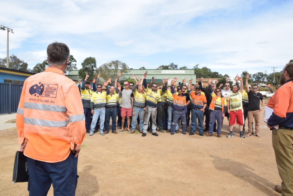 YES: AMWU workers unanimously voted yes to start the process of industrial action against contractor Monadelphous during a meeting in the car park of the soccer fields on Benaraby Rd this afternoon. YES: AMWU workers unanimously voted yes to start the process of industrial action against contractor Monadelphous during a meeting in the car park of the soccer fields on Benaraby Rd this afternoon.