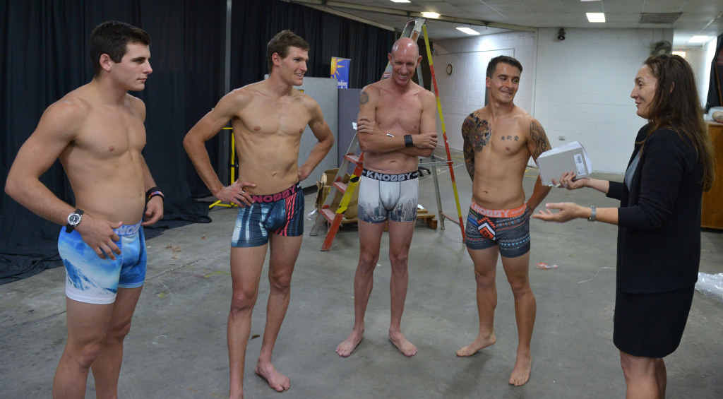MODELS: Raymond Elliott-Howell, Damien Collins, Matt Hold and Jamie Smith with Daily reporter Janine Hill. MODELS: Raymond Elliott-Howell, Damien Collins, Matt Hold and Jamie Smith with Daily reporter Janine Hill.