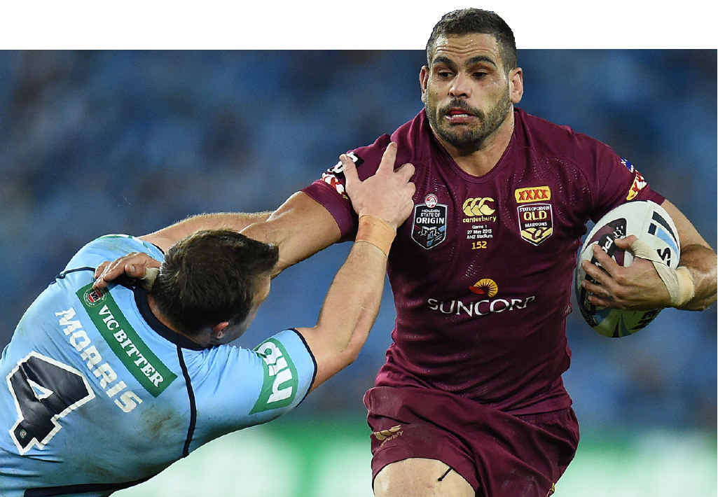DAMAGING: Greg Inglis of the Maroons pushes through a tackle by Josh Morris of the Blues during State of Origin Game I at ANZ Stadium. DAMAGING: Greg Inglis of the Maroons pushes through a tackle by Josh Morris of the Blues during State of Origin Game I at ANZ Stadium.