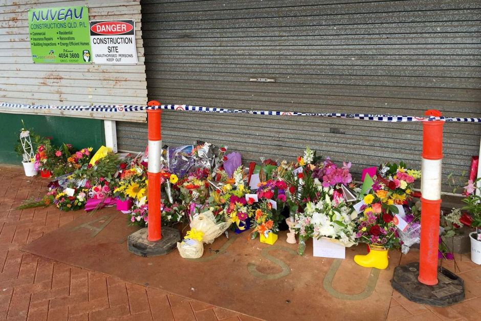 Flowers placed at the doors to the cafe in Ravenshoe torn apart by an explosion on Tuesday. Flowers placed at the doors to the cafe in Ravenshoe torn apart by an explosion on Tuesday.
