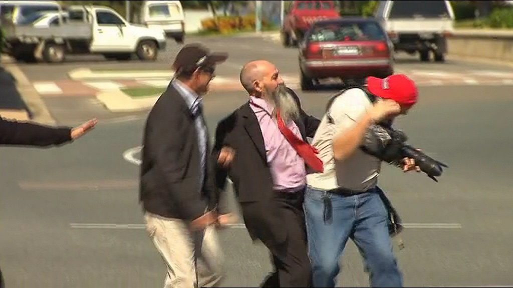 A still from the scuffle between Ian Antonio and a Townsville photographer today. A still from the scuffle between Ian Antonio and a Townsville photographer today.
