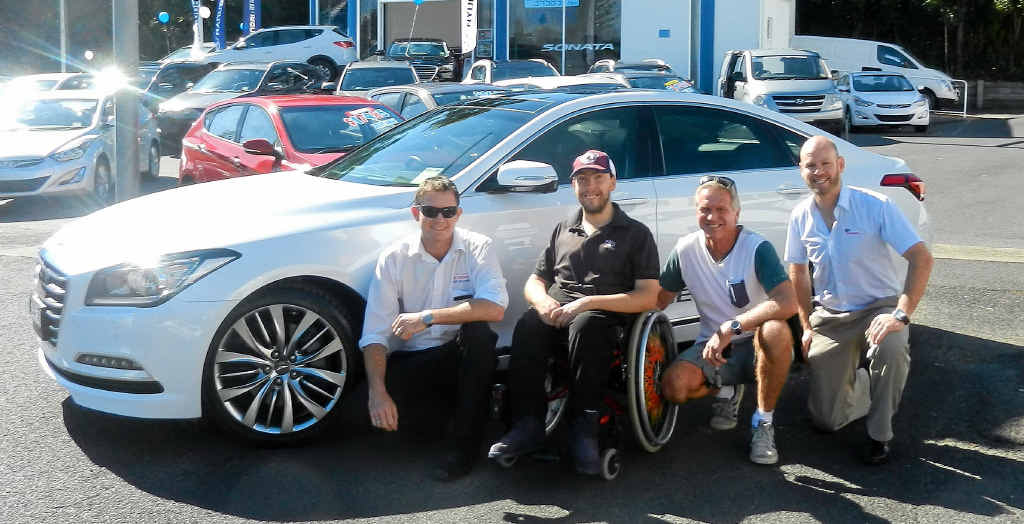 CELEBRATION: Hyundai’s Ryan Webber, Cameron Cooper, support worker Russ Ellis (Coffs Harbour Support Services) and Ian Davie (Key Employment) with the Genesis. CONTRIBUTED CELEBRATION: Hyundai’s Ryan Webber, Cameron Cooper, support worker Russ Ellis (Coffs Harbour Support Services) and Ian Davie (Key Employment) with the Genesis. CONTRIBUTED