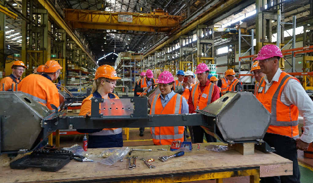Acting Premier Jackie Trad joins an inspection tour of one of the carriages being worked on. Acting Premier Jackie Trad joins an inspection tour of one of the carriages being worked on.