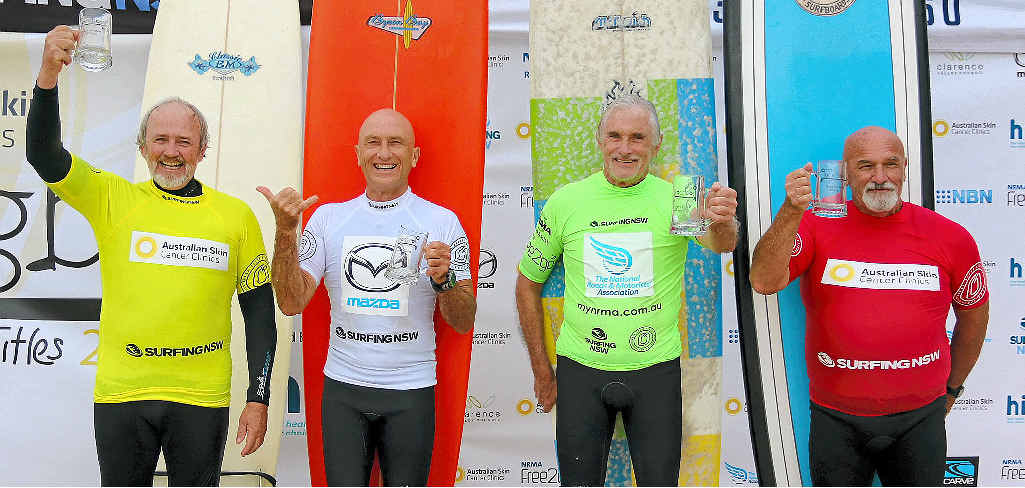 WAVE WARRIORS: Phillip Clifford (2nd, Stuarts Point), Alan Atkins (1st, Suffolk Park), Phil Nichol (3rd, Manly) and David Wilson (4th, Ulladulla) at the Over-65 Men’s presentation of the 2015 NSW Longboard Titles at Yamba yesterday. PHOTO: ETHAN SMITH / SNSW WAVE WARRIORS: Phillip Clifford (2nd, Stuarts Point), Alan Atkins (1st, Suffolk Park), Phil Nichol (3rd, Manly) and David Wilson (4th, Ulladulla) at the Over-65 Men’s presentation of the 2015 NSW Longboard Titles at Yamba yesterday. PHOTO: ETHAN SMITH / SNSW