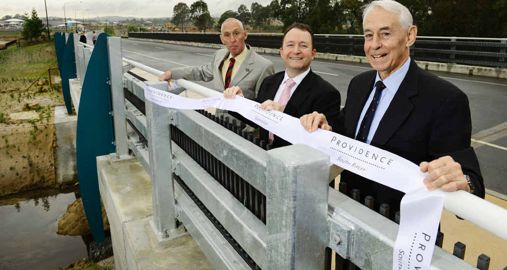IPSWICH HISTORY: Great grandsons of James Ivory, Derek Nixon-Smith (right) and Rod Nixon-Smith (left) with developer Adam Shephard (centre) from Amex Corporation at the opening of the James Ivory Bridge in Providence, South Ripley. IPSWICH HISTORY: Great grandsons of James Ivory, Derek Nixon-Smith (right) and Rod Nixon-Smith (left) with developer Adam Shephard (centre) from Amex Corporation at the opening of the James Ivory Bridge in Providence, South Ripley.