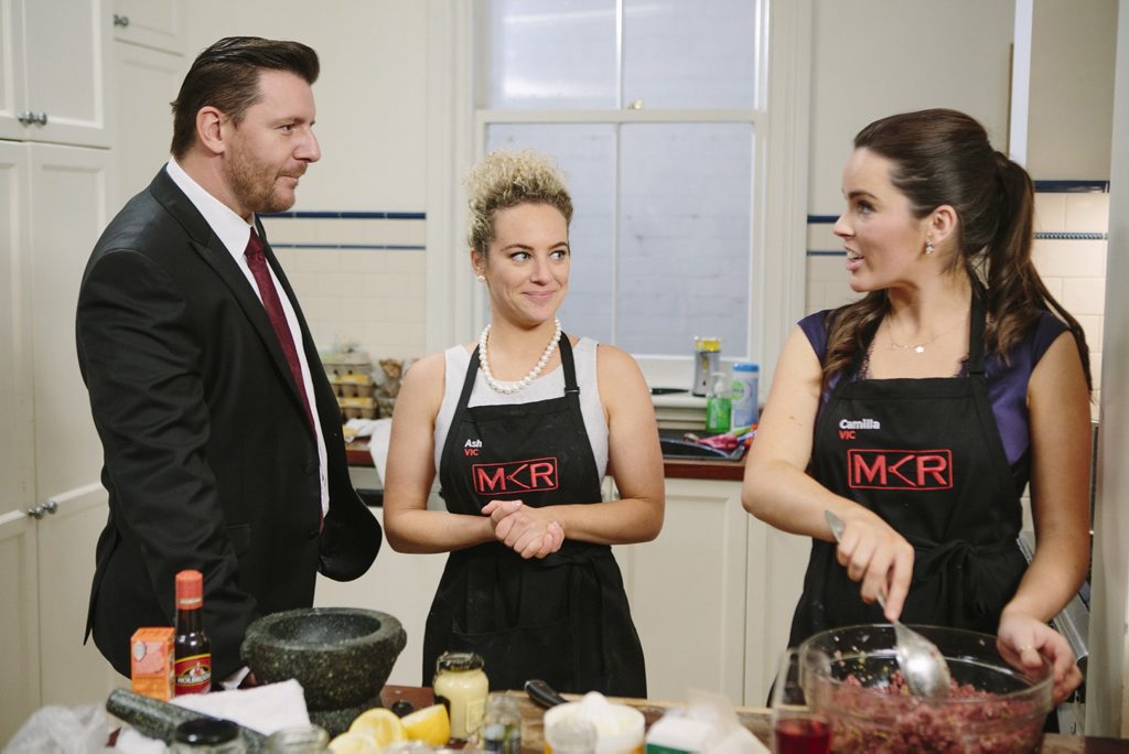 My Kitchen Rules contestants Ash and Camilla pictured with judge Manu Feildel during their instant restaurant. My Kitchen Rules contestants Ash and Camilla pictured with judge Manu Feildel during their instant restaurant.