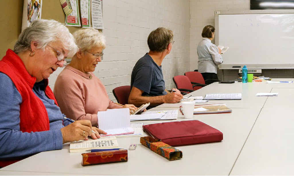 MENTAL CHALLENGE: Nellie Clark and students at U3A Ipswich learning about cryptic crosswords. MENTAL CHALLENGE: Nellie Clark and students at U3A Ipswich learning about cryptic crosswords.