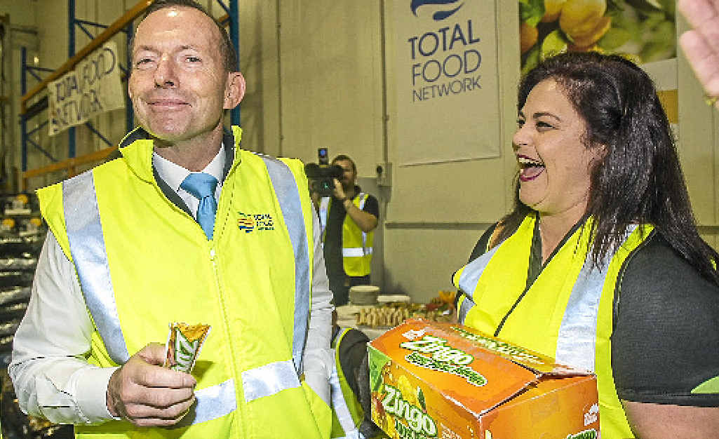 CAMPAIGN MODE: Tony Abbott entertains tomato packer Sonya Mackay at the Total Food Network in Cairns. CAMPAIGN MODE: Tony Abbott entertains tomato packer Sonya Mackay at the Total Food Network in Cairns.