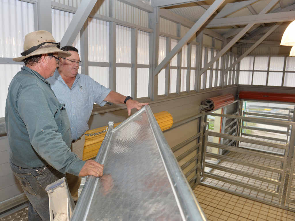 VENUE: Rural contractor Leon Laird, who built the yard, and Landmark livestock auctioneer Paul Cooper in the new cattle centre at the Mackay showgrounds.