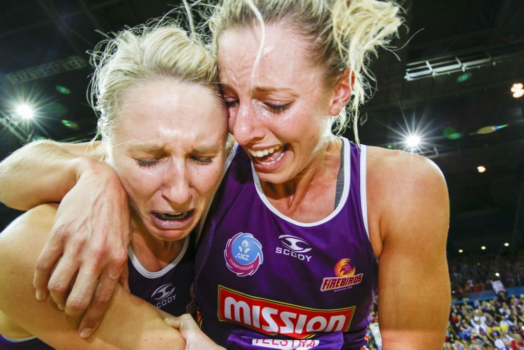 L-R, Firebirds Gabi Simpson and Firebirds Laura Geitz (captain) celebrate winning the Netball Grand Final between the Queensland Firebirds and NSW Swifts in Brisbane, Sunday, June 21, 2015. (AAP Image/Glenn Hunt) NO ARCHIVING, EDITORIAL USE ONLY L-R, Firebirds Gabi Simpson and Firebirds Laura Geitz (captain) celebrate winning the Netball Grand Final between the Queensland Firebirds and NSW Swifts in Brisbane, Sunday, June 21, 2015. (AAP Image/Glenn Hunt) NO ARCHIVING, EDITORIAL USE ONLY