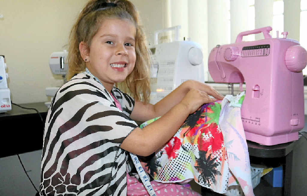 IN STYLE: Indie-Lee Ibbotson, 6, is excited to wear her own garment at the 2015 Calliope Catwalk Fashion Design Awards. IN STYLE: Indie-Lee Ibbotson, 6, is excited to wear her own garment at the 2015 Calliope Catwalk Fashion Design Awards.