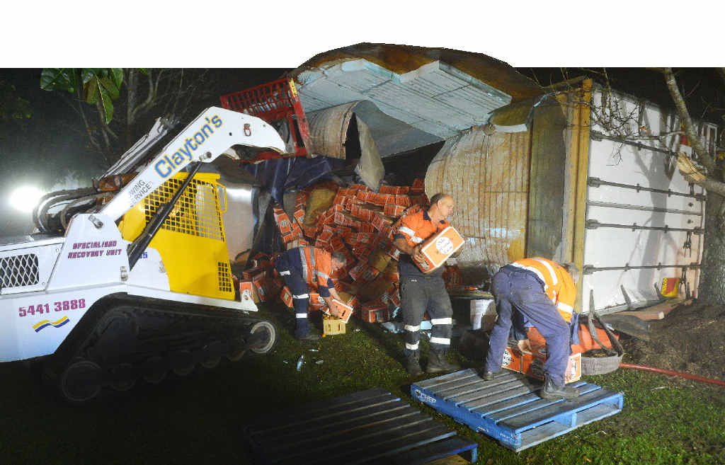 ROLLOVER: Claytons Towing employees worked through the night to help clean up after a produce truck rolled in Gympie. Clean-up operations were still under way yesterday. ROLLOVER: Claytons Towing employees worked through the night to help clean up after a produce truck rolled in Gympie. Clean-up operations were still under way yesterday.