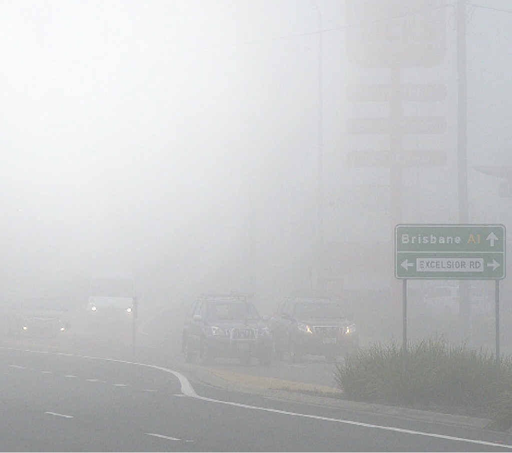 LIGHTS ON: This picture shows the importance of turning on lights while driving in the fog. LIGHTS ON: This picture shows the importance of turning on lights while driving in the fog.