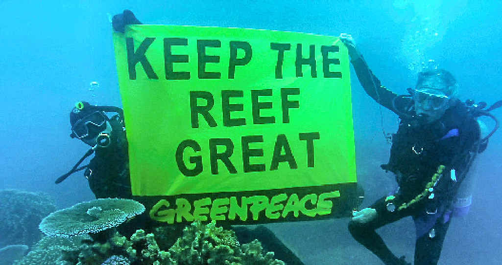 SINKING? Greenpeace activists display a banner during a protest on the Great Barrier Reef. SINKING? Greenpeace activists display a banner during a protest on the Great Barrier Reef.