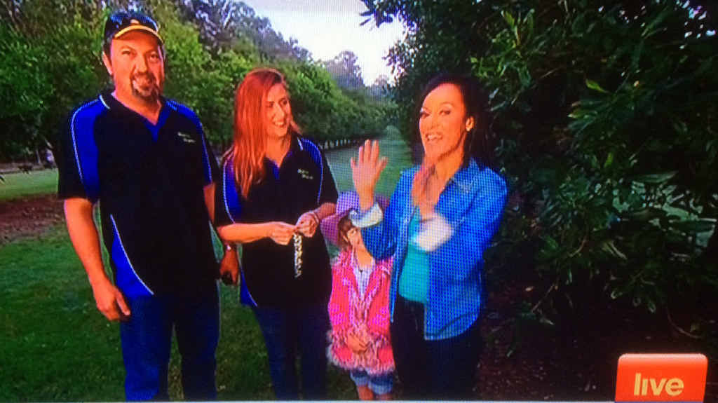 NATIONAL EXPOSURE: Sunrise weather presenter Nuala Hafner with macadamia farmers Belinda and Daniel Blanco on their Wolvi property. NATIONAL EXPOSURE: Sunrise weather presenter Nuala Hafner with macadamia farmers Belinda and Daniel Blanco on their Wolvi property.