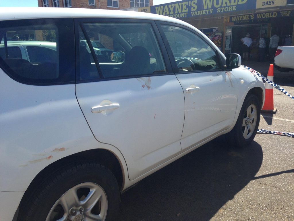 SHOCKING SIGHT: A car marked with blood has been cordoned off. SHOCKING SIGHT: A car marked with blood has been cordoned off.