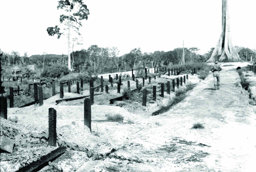 ABOVE RIGHT: Sandakan, October 24, 1945. North East Borneo Force. In an area of no. 1 compound of Sandakan Prisoner of War Camp, the bodies of 300 prisoners were discovered. They were believed to have been those left after two Death Marches to Ranau. ABOVE RIGHT: Sandakan, October 24, 1945. North East Borneo Force. In an area of no. 1 compound of Sandakan Prisoner of War Camp, the bodies of 300 prisoners were discovered. They were believed to have been those left after two Death Marches to Ranau.