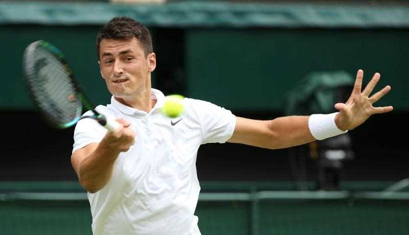 Bernard Tomic of Australia returns to Novak Djokovic of Serbia in their third round match during the Wimbledon Championships at the All England Lawn Tennis Club, in London, Britain, 03 July 2015. Bernard Tomic of Australia returns to Novak Djokovic of Serbia in their third round match during the Wimbledon Championships at the All England Lawn Tennis Club, in London, Britain, 03 July 2015.