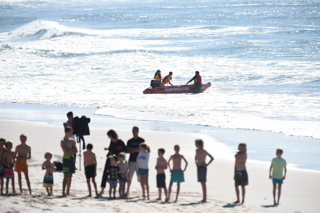Surf Lifesavers watch over an Oz Grom contestants at Lennox Head after two shark attacks in the space of a week. Surf Lifesavers watch over an Oz Grom contestants at Lennox Head after two shark attacks in the space of a week.