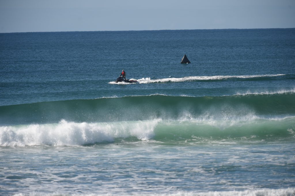 Surf Lifesavers watch over an Oz Grom contestants at Lennox Head after two shark attacks in the space of a week. Surf Lifesavers watch over an Oz Grom contestants at Lennox Head after two shark attacks in the space of a week.