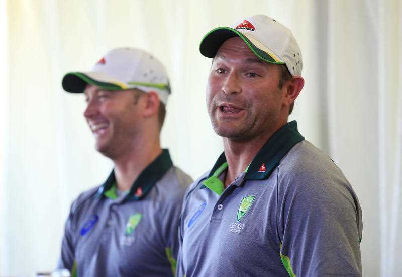 Australia's Ryan Harris, right, who Saturday July 4, 2015, retired from all forms of cricket due to injury, speaks with the media alongside captain Michael Clarke after the tour match at the at the Essex County Ground, Chelmsford, eastern England. Australia's Ryan Harris, right, who Saturday July 4, 2015, retired from all forms of cricket due to injury, speaks with the media alongside captain Michael Clarke after the tour match at the at the Essex County Ground, Chelmsford, eastern England.