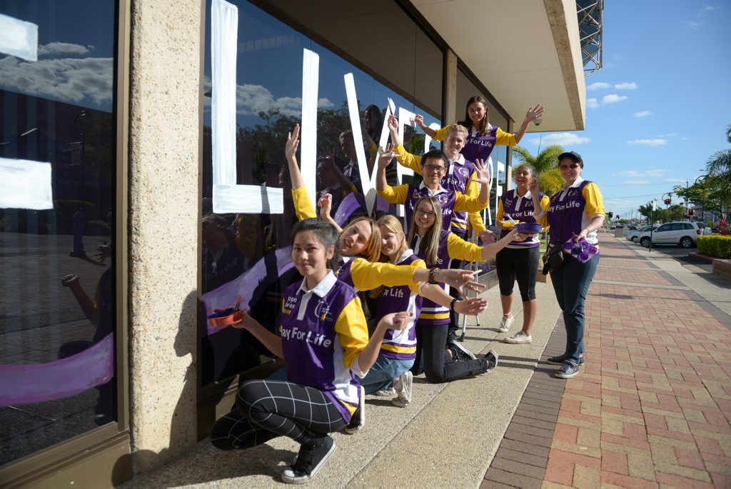 SHOW YOUR SUPPORT: North Bundaberg High School students paint the windows at the front of the Bundaberg Regional Council to help raise awareness for Relay for Life. Photo: Max Fleet / NewsMail SHOW YOUR SUPPORT: North Bundaberg High School students paint the windows at the front of the Bundaberg Regional Council to help raise awareness for Relay for Life. Photo: Max Fleet / NewsMail