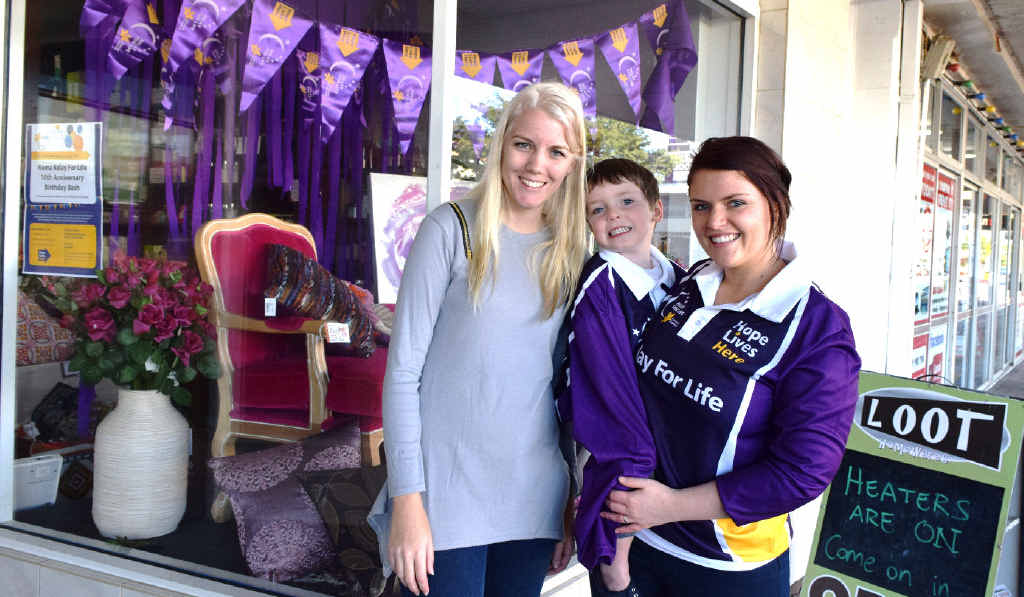 PURPLE POWER: Supporting the Relay For Life Paint The Town Purple campaign is Loot Homewares Roma owner Erin Brumpton with local branch member Lisa Becky and son Tyler. PURPLE POWER: Supporting the Relay For Life Paint The Town Purple campaign is Loot Homewares Roma owner Erin Brumpton with local branch member Lisa Becky and son Tyler.