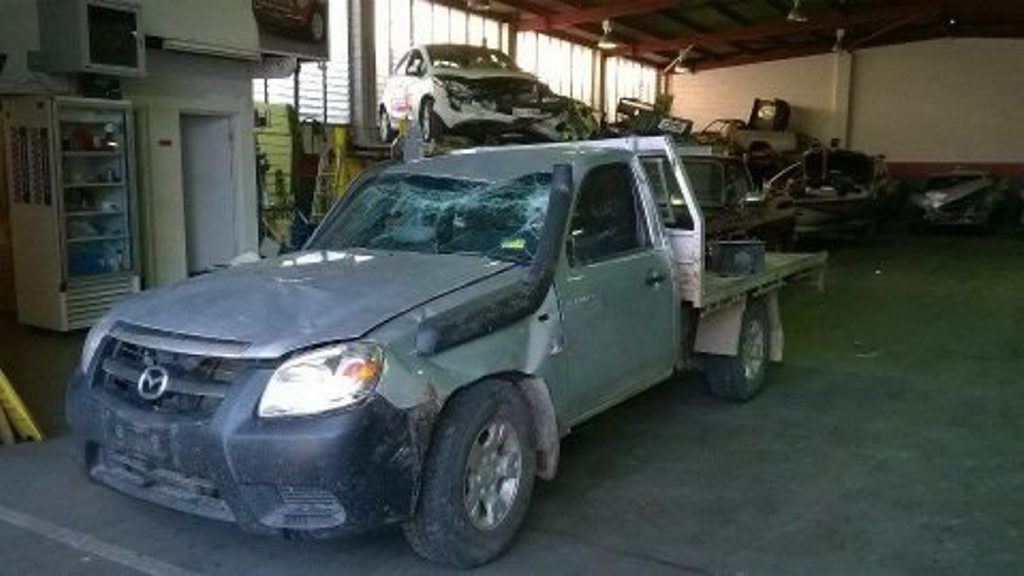The mangled Mazda BT50 ute from which Logan Johnston, 17, walked with no injuries after it rolled Wednesday morning. The mangled Mazda BT50 ute from which Logan Johnston, 17, walked with no injuries after it rolled Wednesday morning.