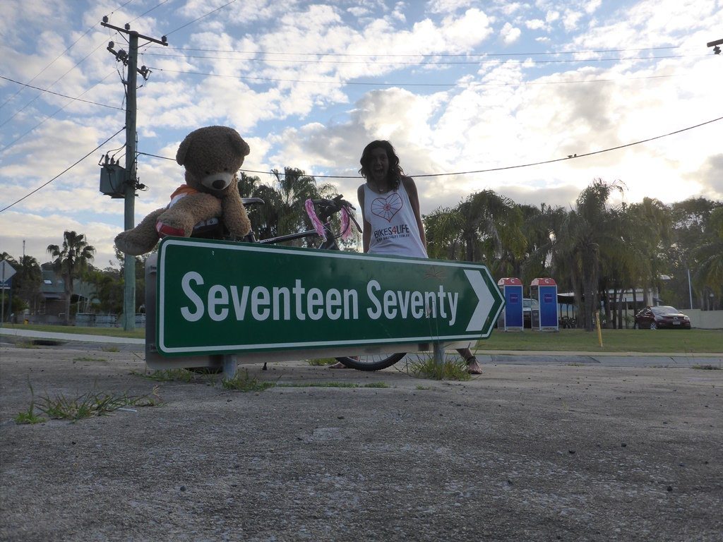Adeena Gerding and her bear are cycling from Sydney to Cairns to raise funds for Bikes 4 Life. They're enjoying their time in Agnes Water/1770.