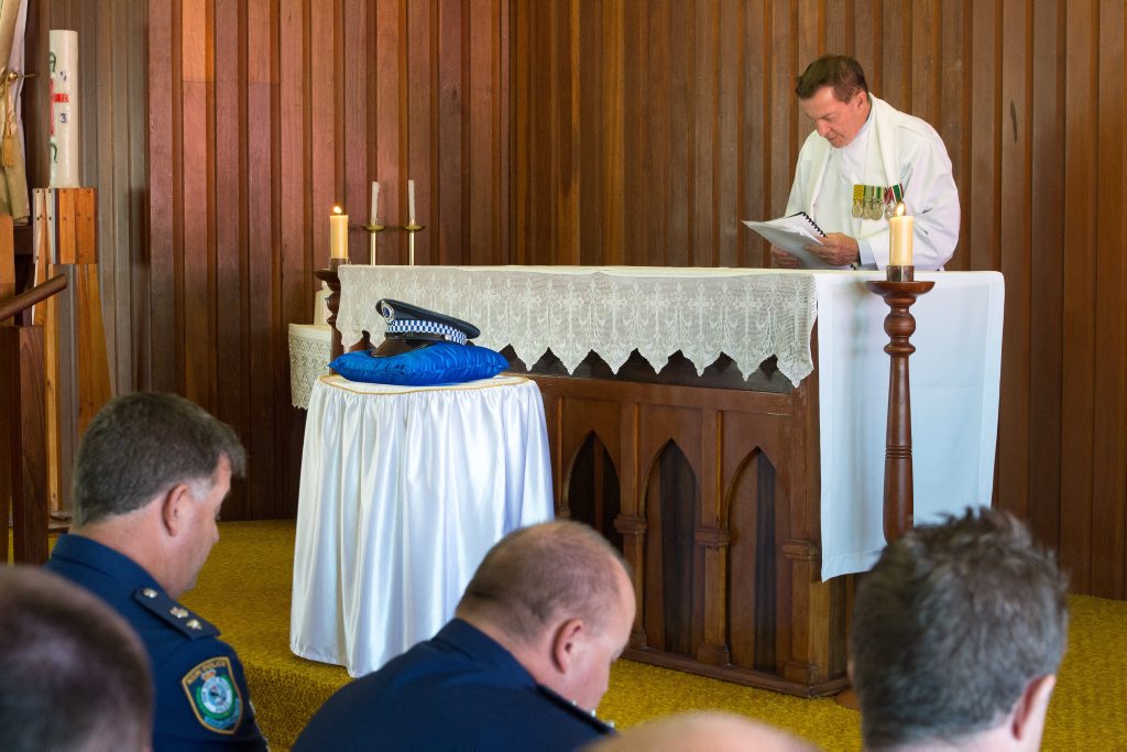 Former Sawtell parish priest Father John Casey performing at a Police Remembrance day service at Sawtell's Mary Help of Christians church. Former Sawtell parish priest Father John Casey performing at a Police Remembrance day service at Sawtell's Mary Help of Christians church.