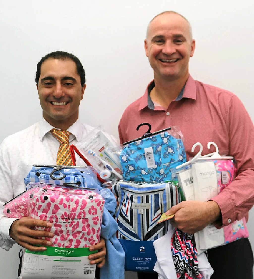 FOR KIDS: Cr PJ Sobhanian and Gladstone MP Glenn Butcher donate pyjamas. FOR KIDS: Cr PJ Sobhanian and Gladstone MP Glenn Butcher donate pyjamas.