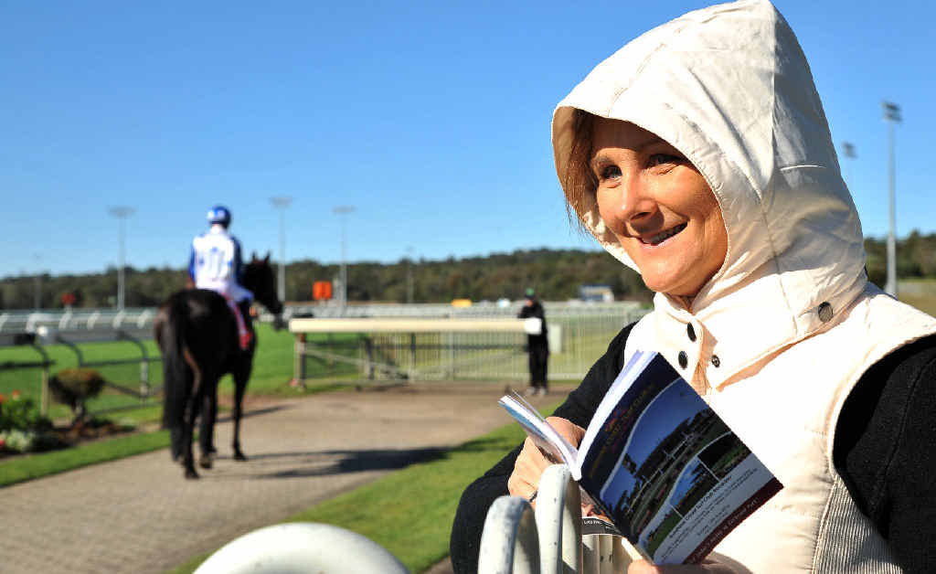 RUGGED UP: Alyssa Cook keeps warm at Corbould Park yesterday. RUGGED UP: Alyssa Cook keeps warm at Corbould Park yesterday.