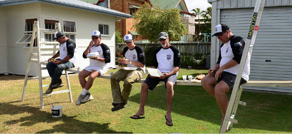 LUNCH BREAK: Berger Paint For a Mate volunteers enjoy a well-earned lunch break. LUNCH BREAK: Berger Paint For a Mate volunteers enjoy a well-earned lunch break.