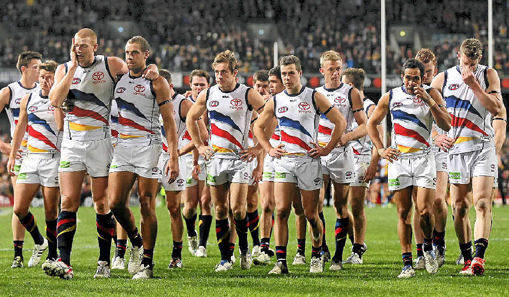 Emotional Crows players walk from the field after being defeated by the Eagles on Saturday night. Emotional Crows players walk from the field after being defeated by the Eagles on Saturday night.